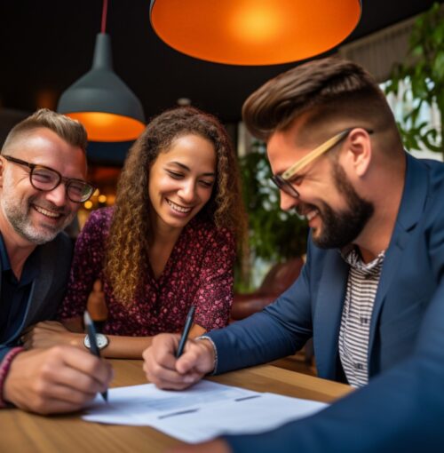 Agent and a couple signing a contract close up backgrounds